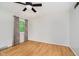 An empty bedroom has a window with curtains and hardwood floors at 6146 Rucker Rd, Indianapolis, IN 46220