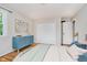 Comfortable bedroom with hardwood floors, modern dresser, and natural light at 6146 Rucker Rd, Indianapolis, IN 46220