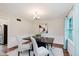 Dining room with modern table, carpet, and a lot of natural light at 6146 Rucker Rd, Indianapolis, IN 46220