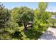 Charming home with mature trees and lush green lawn creates a welcoming and serene front yard at 6146 Rucker Rd, Indianapolis, IN 46220