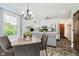 Bright kitchen and dining area with modern appliances, white cabinets, and updated lighting at 6146 Rucker Rd, Indianapolis, IN 46220