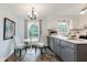 Eat-in kitchen features white cabinets, modern appliances, and light-filled space at 6146 Rucker Rd, Indianapolis, IN 46220