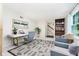 Cozy living space with stylish decor, a desk, and comfortable seating area at 6146 Rucker Rd, Indianapolis, IN 46220