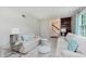 The living room boasts neutral tones, two sofas, and light-filled space at 6146 Rucker Rd, Indianapolis, IN 46220