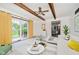 Bright living room boasts lots of natural light with an adjacent view of the kitchen at 6146 Rucker Rd, Indianapolis, IN 46220