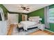 Spacious main bedroom showcasing a walk-in closet, ensuite bath and natural light at 6146 Rucker Rd, Indianapolis, IN 46220