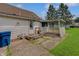 Backyard view with back door and covered patio at 616 S Fuller Dr, Indianapolis, IN 46241