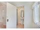 Bathroom featuring a sink, mirror, and pedestal sink with decorative mirror and white trim at 616 S Fuller Dr, Indianapolis, IN 46241