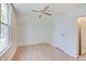 A bedroom featuring neutral walls, ceiling fan, and two closets at 616 S Fuller Dr, Indianapolis, IN 46241