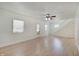 Inviting living room with laminate wood floors, white walls, and natural light at 616 S Fuller Dr, Indianapolis, IN 46241