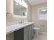 Bathroom vanity featuring gray cabinets, white countertop and modern fixtures at 6477 N Park Ave, Indianapolis, IN 46220