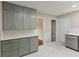 Bright kitchen featuring gray cabinets, white countertops and marble floors at 6477 N Park Ave, Indianapolis, IN 46220