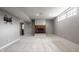 Finished basement featuring a cozy fireplace and neutral carpeting for comfortable living at 6685 Chapel Xing, Zionsville, IN 46077