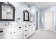 Spacious bathroom with a double vanity, elegant mirrors, and a glass-enclosed shower at 6685 Chapel Xing, Zionsville, IN 46077
