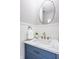 Stylish powder room with a modern vanity, elegant mirror, and decorative wainscoting at 6685 Chapel Xing, Zionsville, IN 46077