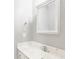 Updated bathroom with a modern vanity, marble countertop, and a stylish mirror at 6685 Chapel Xing, Zionsville, IN 46077