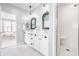 Inviting bathroom featuring a double vanity, stylish mirrors, and a glass-enclosed shower at 6685 Chapel Xing, Zionsville, IN 46077