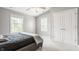 Spacious bedroom with vaulted ceilings, a ceiling fan, and natural light streaming in from the windows at 6685 Chapel Xing, Zionsville, IN 46077