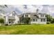 Well-maintained home featuring a screened porch and lush landscaping, creating a serene outdoor living space at 6685 Chapel Xing, Zionsville, IN 46077