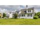 Well-maintained home featuring a screened porch and lush landscaping, creating a serene outdoor living space at 6685 Chapel Xing, Zionsville, IN 46077