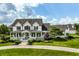 Elegant home featuring a spacious front porch, beautiful landscaping, and a serene curb appeal at 6685 Chapel Xing, Zionsville, IN 46077
