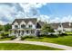Stately home with a welcoming front porch, manicured landscaping, and a circular driveway at 6685 Chapel Xing, Zionsville, IN 46077