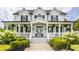 Charming two-story home with a inviting covered front porch and beautifully landscaped front yard at 6685 Chapel Xing, Zionsville, IN 46077
