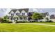 Stunning two-story home with a classic front porch, complemented by meticulous landscaping and a sweeping green lawn at 6685 Chapel Xing, Zionsville, IN 46077