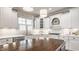Well-lit kitchen featuring custom white cabinets, modern appliances, and stylish backsplash at 6685 Chapel Xing, Zionsville, IN 46077