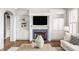 Elegant living room showcasing a fireplace with custom built-ins and a modern television at 6685 Chapel Xing, Zionsville, IN 46077