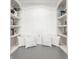 Cozy sitting area with custom built-in bookshelves and comfortable pillows at 6685 Chapel Xing, Zionsville, IN 46077