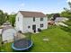 Spacious backyard with a trampoline, shed, grill, firepit, and patio perfect for entertaining at 6927 Rose Tree Ct, Indianapolis, IN 46237