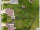 Aerial view of the backyard featuring a trampoline, lush lawn, and privacy fence at 6927 Rose Tree Ct, Indianapolis, IN 46237