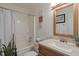 Bright bathroom with a vanity, shower with tub, and modern updates at 6927 Rose Tree Ct, Indianapolis, IN 46237