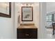 Stylish half bathroom with granite countertop vanity and modern fixtures at 6927 Rose Tree Ct, Indianapolis, IN 46237