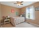 Cozy bedroom featuring natural light, a side table, and carpet floors at 6927 Rose Tree Ct, Indianapolis, IN 46237