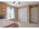 Bedroom with carpet, natural light, and a double door closet at 6927 Rose Tree Ct, Indianapolis, IN 46237