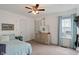 Bright bedroom with carpet floors and bright colored accents at 6927 Rose Tree Ct, Indianapolis, IN 46237