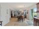 Open concept dining area with tile floors and access to the patio and living room at 6927 Rose Tree Ct, Indianapolis, IN 46237