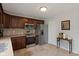 Modern kitchen with stainless steel appliances, wood cabinets and tile flooring at 6927 Rose Tree Ct, Indianapolis, IN 46237