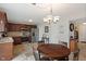 Eat-in kitchen features stainless steel appliances, wood cabinets and tile backsplash at 6927 Rose Tree Ct, Indianapolis, IN 46237