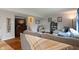 Cozy living room featuring a large sectional couch and a view of the staircase at 6927 Rose Tree Ct, Indianapolis, IN 46237