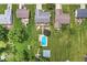 Aerial view of a home with a private backyard pool, shed, and landscaped yard at 7025 Chimney Rock Ct, Indianapolis, IN 46217