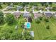 Neighborhood view highlighting mature trees, well-manicured lawns, and a private pool at 7025 Chimney Rock Ct, Indianapolis, IN 46217