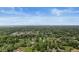Expansive aerial view showcasing a neighborhood with lush greenery and distant cityscape views at 7025 Chimney Rock Ct, Indianapolis, IN 46217