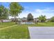Expansive backyard featuring an in-ground pool, mature trees, and a basketball court at 7025 Chimney Rock Ct, Indianapolis, IN 46217