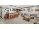 Finished basement features a wet bar, stools, and comfortable seating, ideal for entertaining and relaxation at 7025 Chimney Rock Ct, Indianapolis, IN 46217