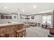 Finished basement with a bar area, comfortable seating, and entertainment space for gatherings and relaxation at 7025 Chimney Rock Ct, Indianapolis, IN 46217