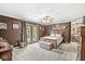 The spacious main bedroom boasts carpet flooring, neutral paint, and a ceiling fan at 7025 Chimney Rock Ct, Indianapolis, IN 46217