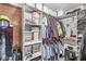 Organized walk-in closet featuring shelving, hanging racks, and storage containers for efficient space utilization at 7025 Chimney Rock Ct, Indianapolis, IN 46217